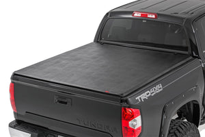 Open image in slideshow, TOYOTA SOFT TRI-FOLD BED COVER (14-18 TUNDRA)
